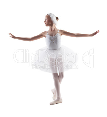 Cute little ballerina dancing role of white swan