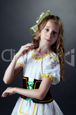 Portrait of cute gray-eyed dancer in folk dress