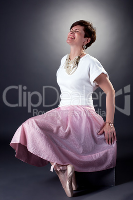 Cheerful stylish woman posing in pointes