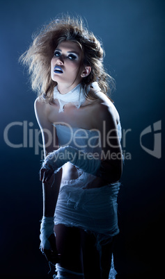 Fashion snapshot - beautiful girl posing as zombie