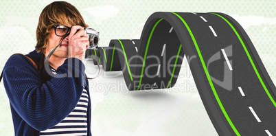 Composite image of hipster taking pictures with an old camera