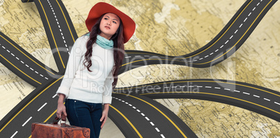 Composite image of asian woman with hat holding luggage