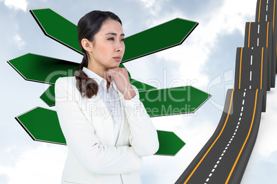 Composite image of asian businesswoman touching her chin