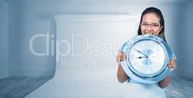 Composite image of delighted businesswoman holding a clock
