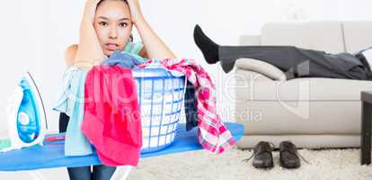 Composite image of woman fed up with ironing