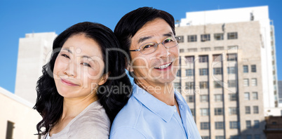 Composite image of couple with their backs to each other