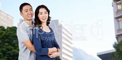 Composite image of cheerful couple embracing