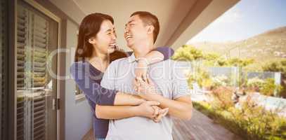 Composite image of loving woman embracing man