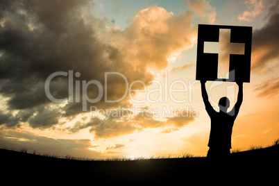 Composite image of cheering male silhouette