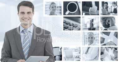 Composite image of businessman using a tablet  with colleagues b