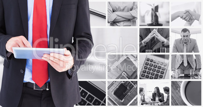 Composite image of businessman scrolling on his digital tablet