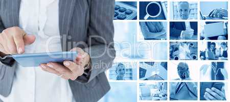 Composite image of  businesswoman using her tablet