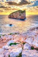 Landscape with sunset on the coast with island in the background