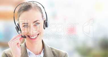 Composite image of smiling businesswoman with headset looking at