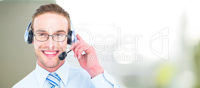 Composite image of smiling businessman with headset interacting