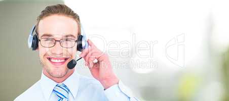 Composite image of smiling businessman with headset interacting