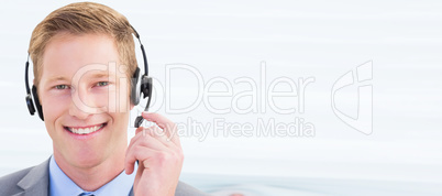 Composite image of handsome agent wearing headset