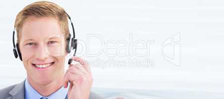 Composite image of handsome agent wearing headset