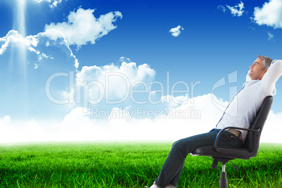 Composite image of side view of man sleeping on chair