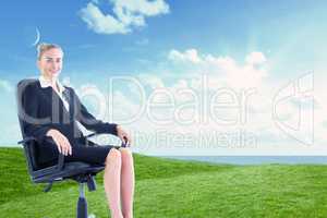 Composite image of businesswoman sitting on swivel chair in blac