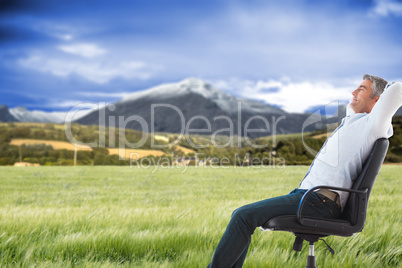 Composite image of side view of man sleeping on chair