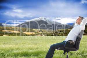 Composite image of side view of man sleeping on chair