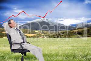 Composite image of side view of businessman leaning back in his
