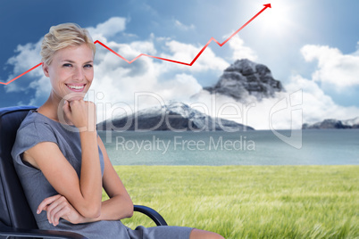 Composite image of portrait of smiling businesswoman sitting on