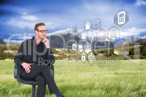 Composite image of thoughtful businessman sitting on a swivel ch