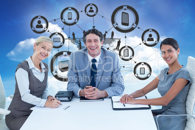 Composite image of portrait of smiling business people sitting a