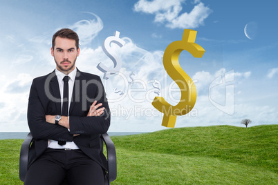 Composite image of serious businessman sitting with arms crossed