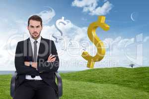 Composite image of serious businessman sitting with arms crossed