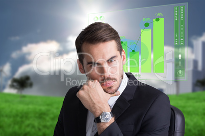 Composite image of cheerful businessman posing with hand on chin