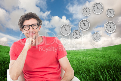 Composite image of happy businessman wearing reading glasses whi