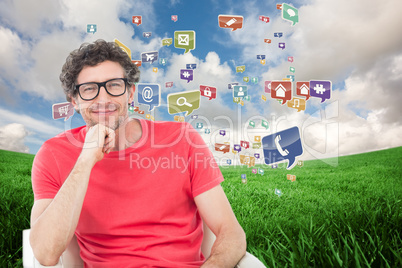 Composite image of happy businessman wearing reading glasses whi