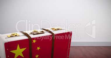 Composite image of chinese flag suitcase