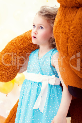 Beautiful little girl posing with teddy bear