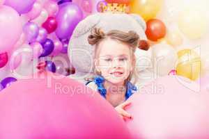 Portrait of lovely little girl posing in playroom