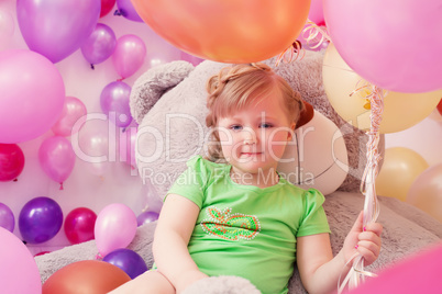 Image of cute little girl with big teddy bear