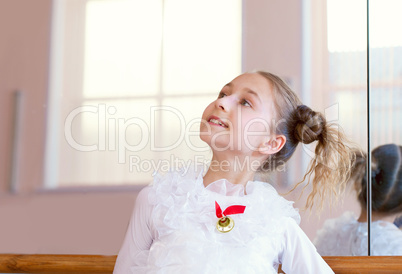 Image of smiling young ballerina posing at camera