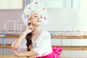 Pretty ballerina posing in Russian kokoshnik
