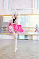 Graceful ballerina dancing in Russian costume