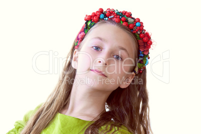 Lovely little dancer posing with wreath, close-up