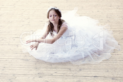 Charming girl dancing in ballet studio