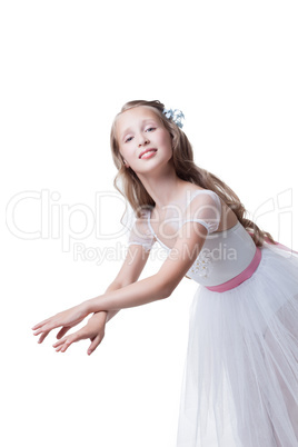 Graceful young girl posing in dance at camera