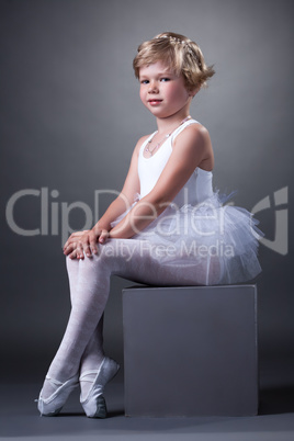 Studio shot of adorable girl posing in tutu