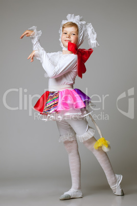 Lovely little girl dancing in colorful costume