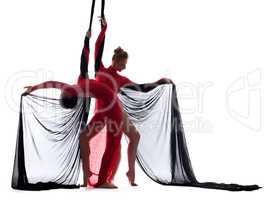 Sexy young dancers posing with silk ropes