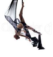 Elegant sexy dancer posing hanging on cloth