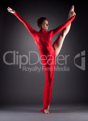 Beautiful slim dancer doing vertical split